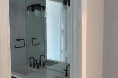 1/4" Mirror wall to wall and vanity to ceiling