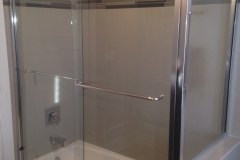 semi-frameless sliding shower door with return panel